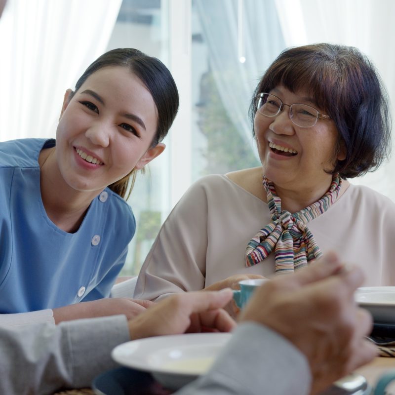 Attractive young senior asian citizen couple happy sit, talk, eat soup for healthy nutrition Attractive young senior asian citizen couple happy sit, talk, eat soup for healthy nutrition